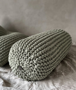 Chunky knitted bolster footrest | LIGHT OLIVE