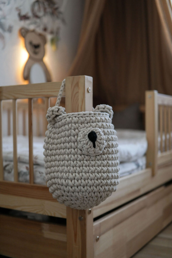 crochet bear basket hanging on the  kids bed