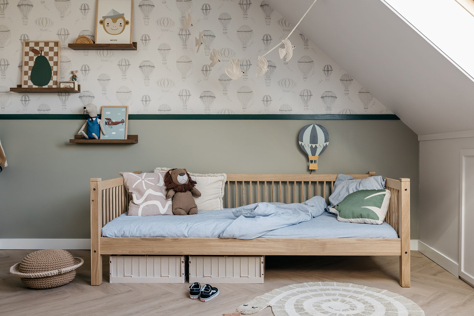 Children's bedroom with wooden bed, toys, and decorative elements.