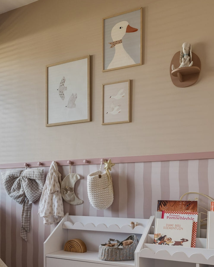 Children's room with toys, shelves, and wall decorations.