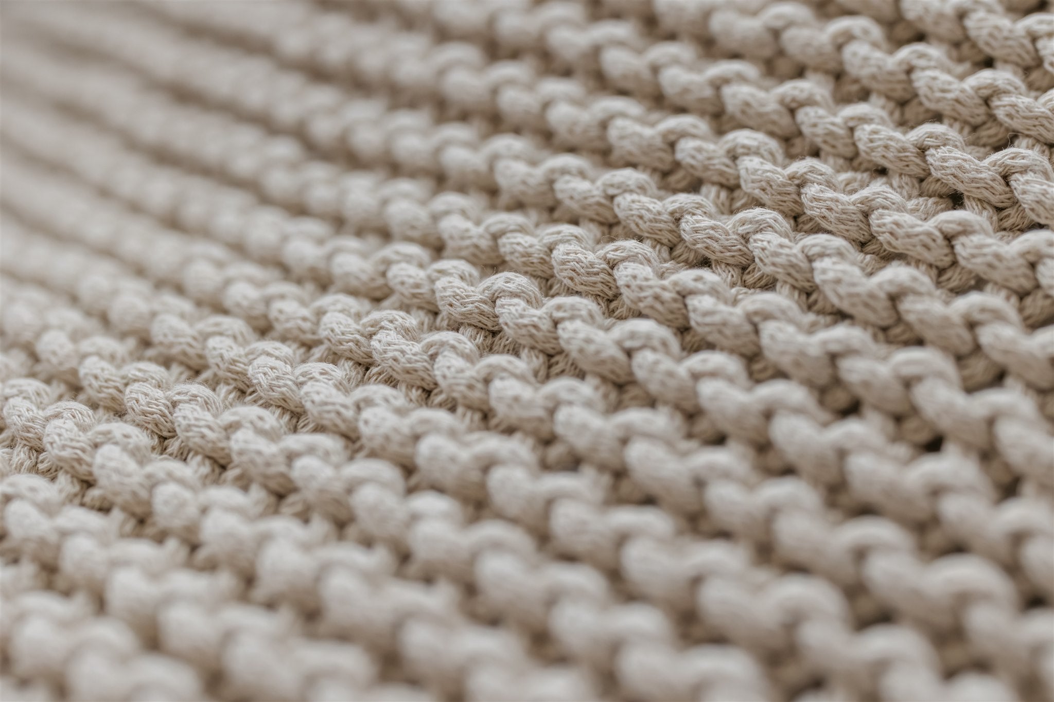 Close-up of beige woven fabric texture