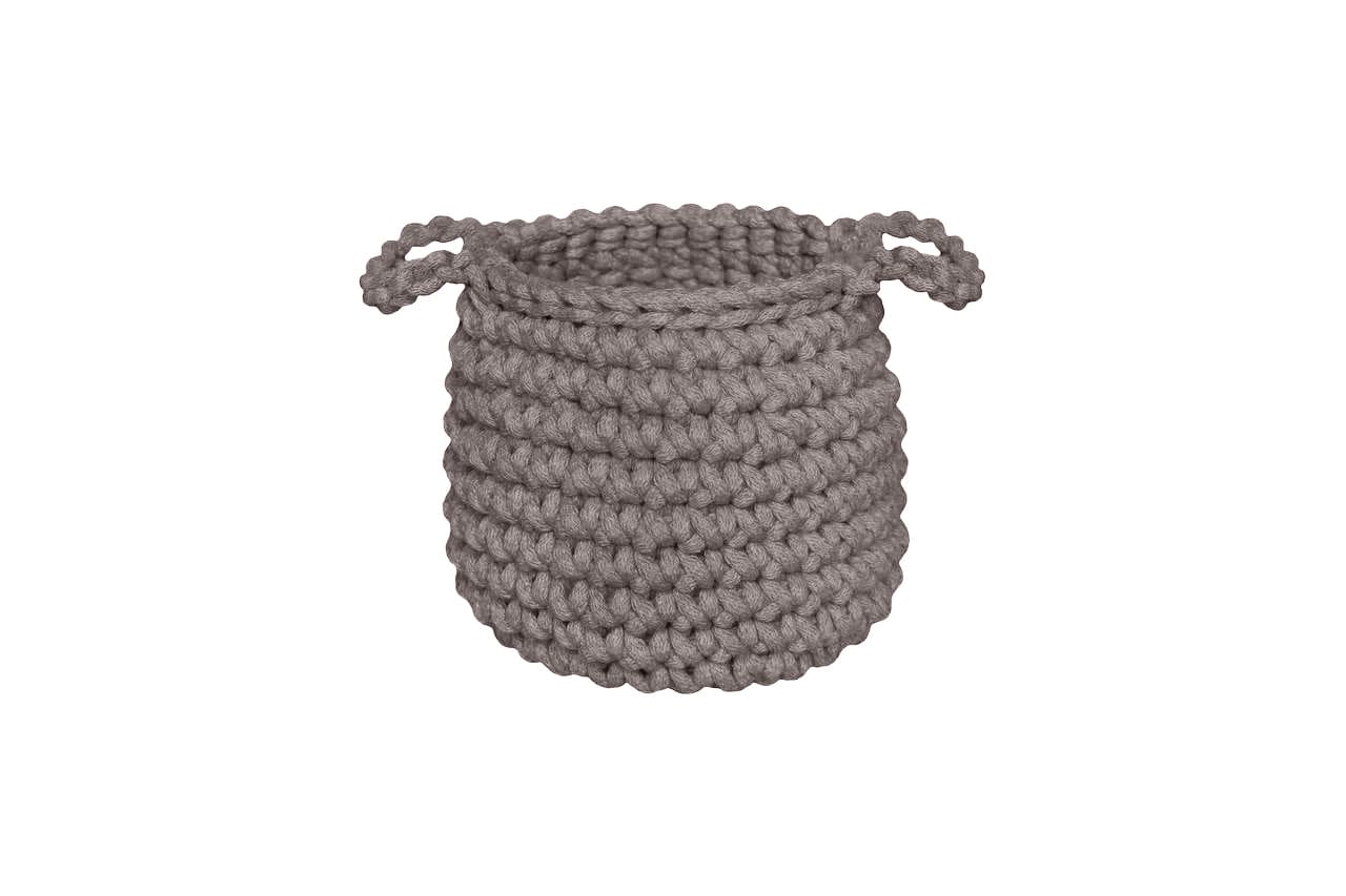 Gray woven basket on a white background