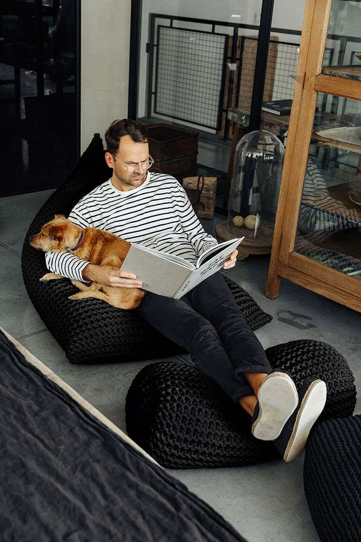 Chunky knitted bolster footrest | CHARCOAL - Zuri House
