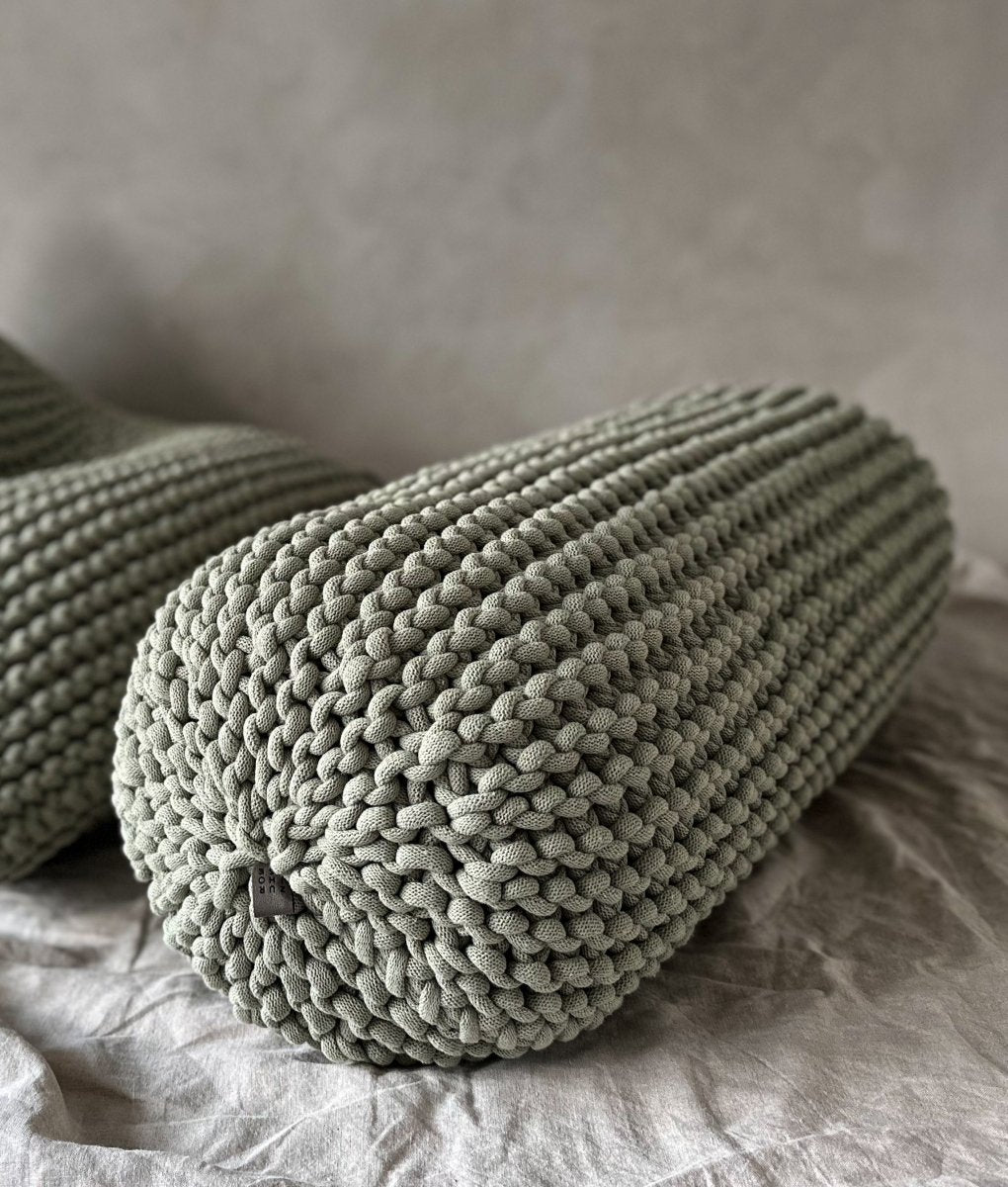 Chunky knitted bolster footrest | LIGHT OLIVE - Zuri House