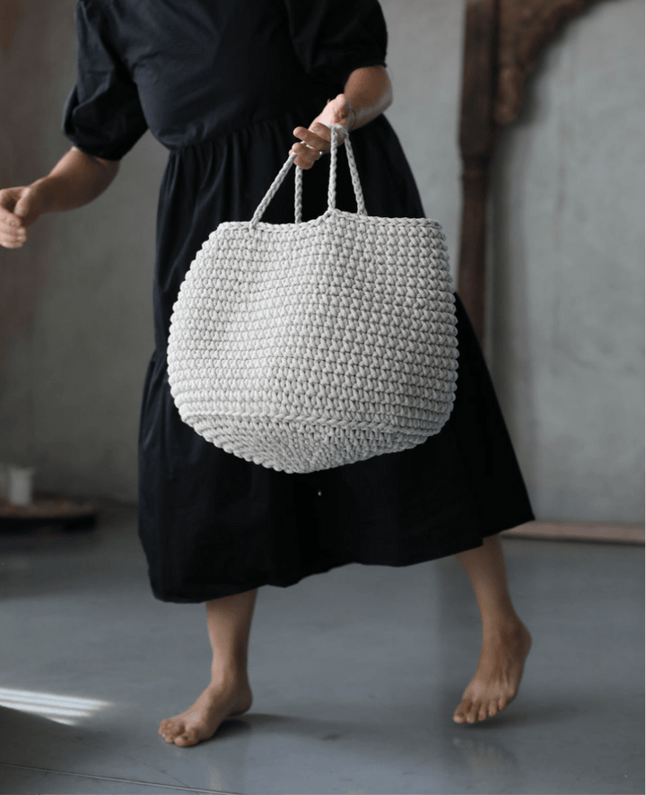 Neutral-toned crochet storage basket in oatmeal cotton, perfect for living rooms, bedrooms or shelves