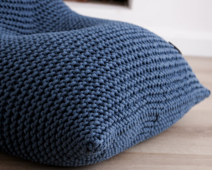 Close-up of thick cotton loops in a denim blue knitted bean bag