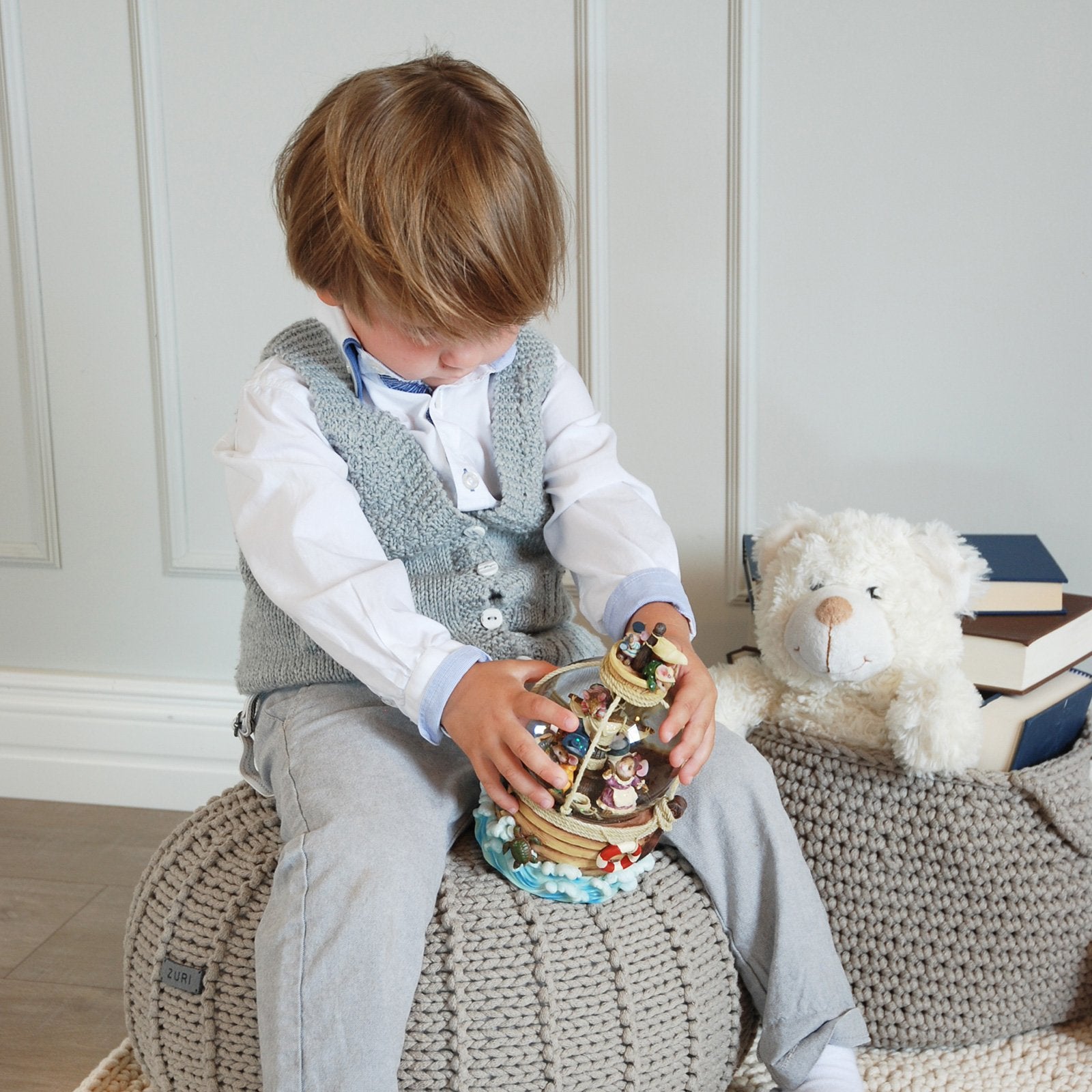 Beige pouffe used as footstool or extra seat