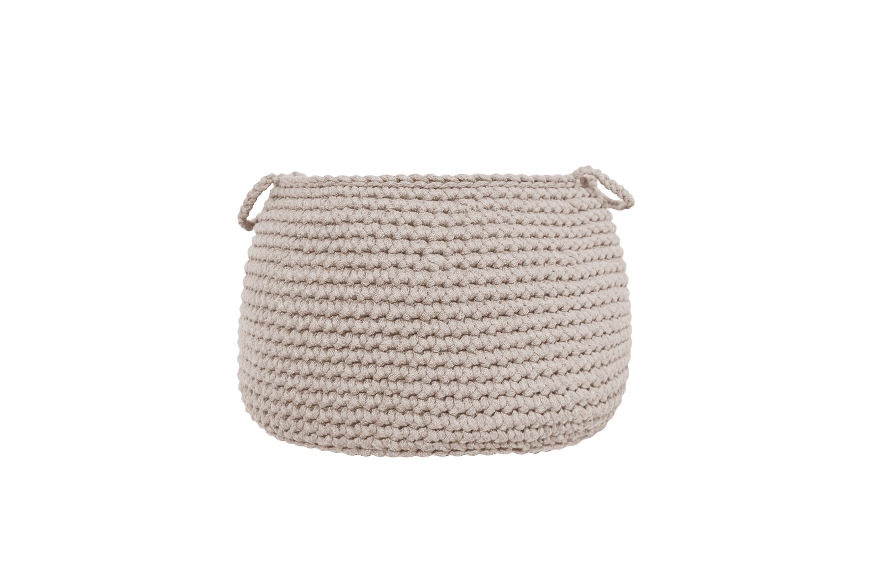 Soft-toned crochet basket in beige, used for toy organisation in a calm, minimalist nursery