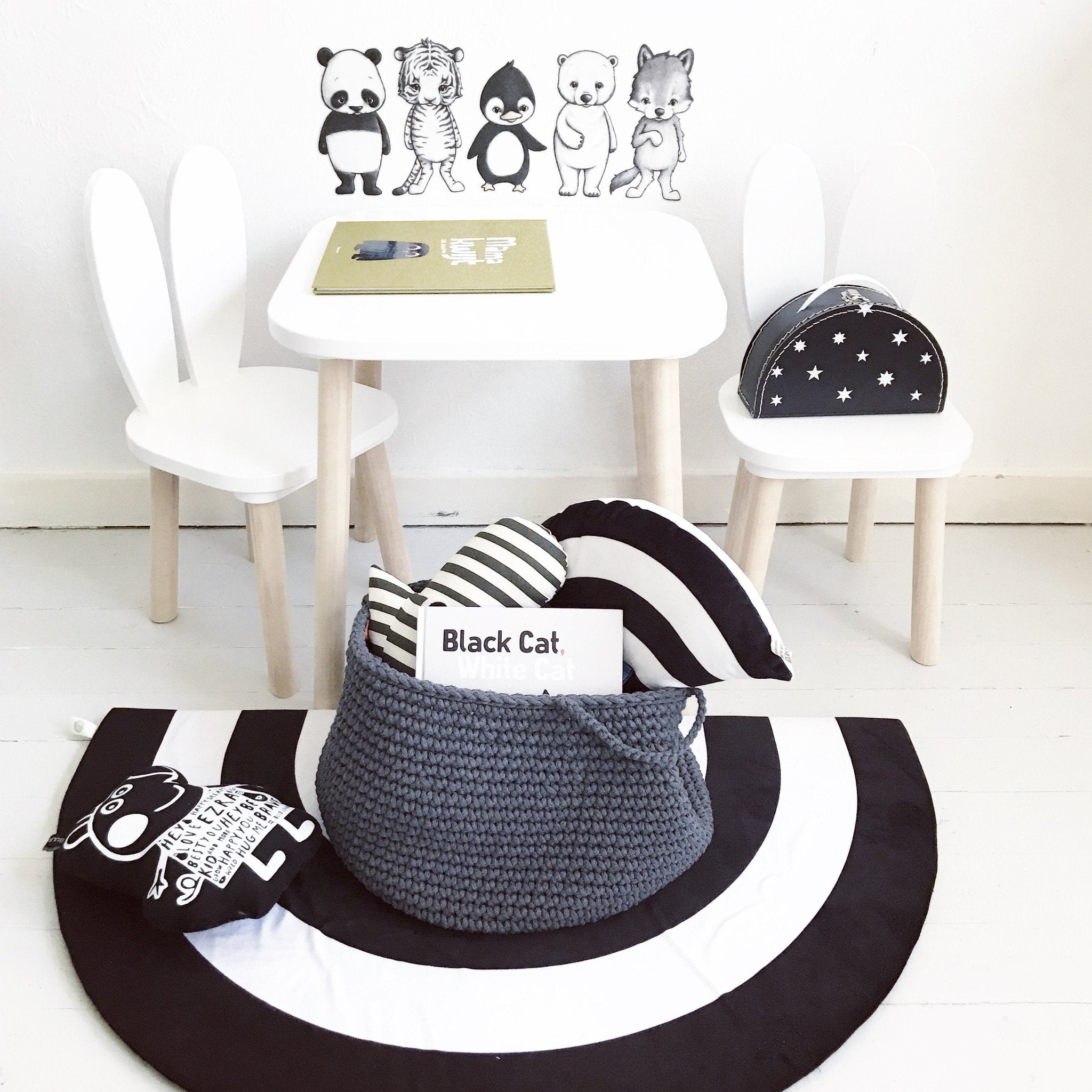 Durable cotton basket in charcoal colour, holding blocks and books in a playroom setting