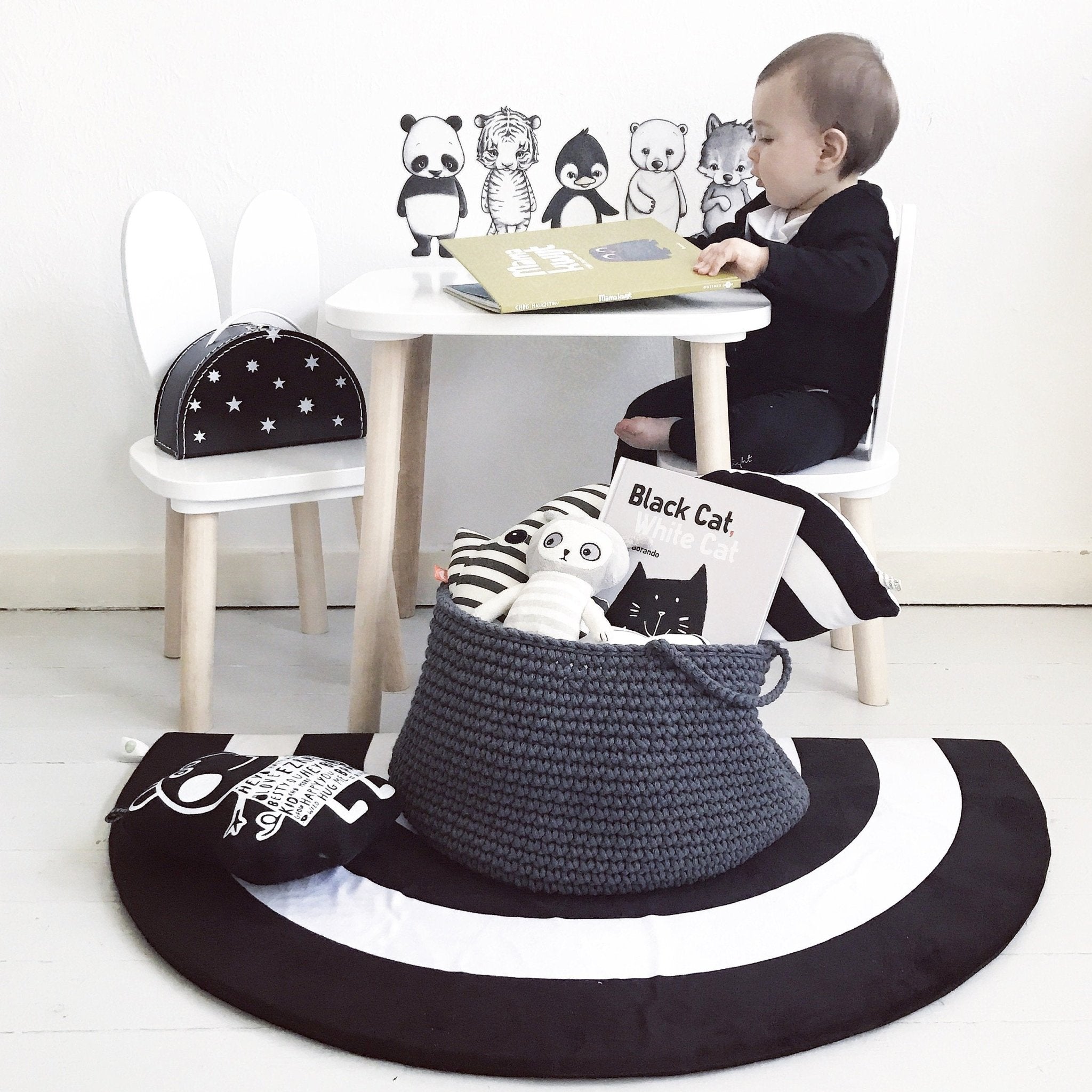Charcoal cotton storage basket used for organising kids’ toys in a modern nursery