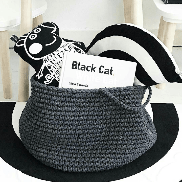 Handmade charcoal crochet basket filled with soft toys, perfect for children's room storage