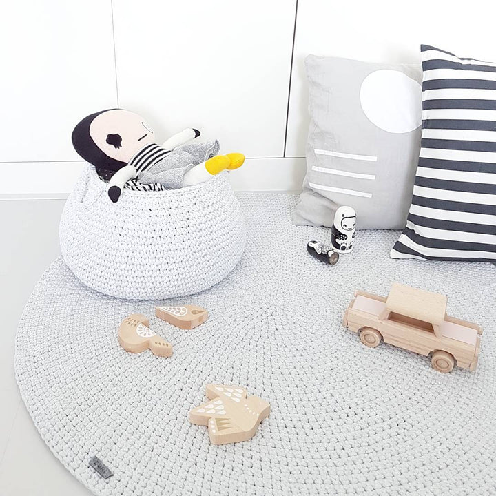 Neutral grey crochet storage basket for baby essentials, handmade from cotton cord